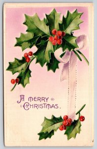 Holiday~Holly Hanging By Ribbon Christmas Greeting~Vintage Postcard