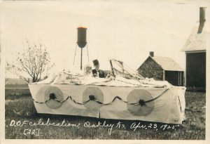 Postcard RPPC Kansas Oakley DOE Celebration 1925 Silverwood Float Logan 23-8376
