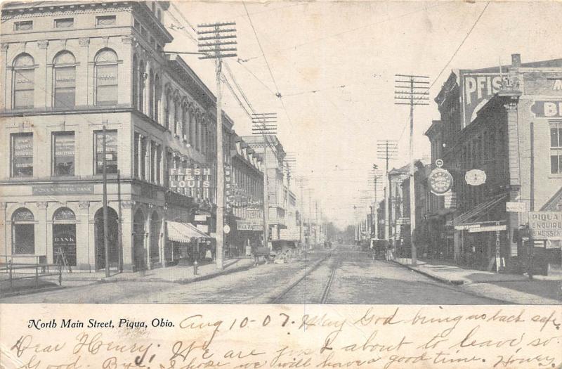 C6/ Piqua Ohio Postcard 1907 North Main Street Stores Flesh Louis Bank