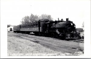 Real Photo Postcard Cadillac and Lake City Railway Train in Lake City, Michigan