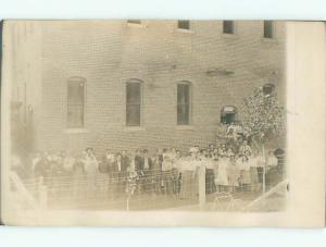 Pre-1920's rppc GROUP SHOT - MEN ON THE LEFT - WOMEN ON THE RIGHT o2229