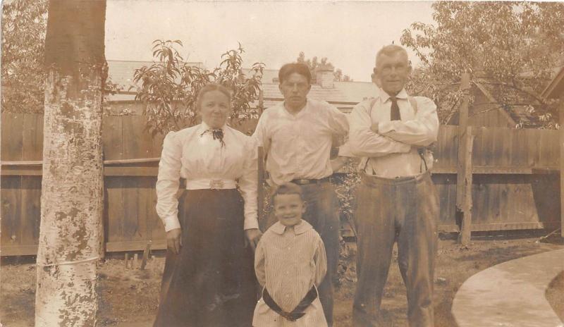 B41/ Wellsburg West Virginia WV RPPC Postcard Family Home Smile