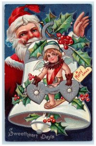 1911 Christmas Ringing Bell Santa Claus Pipe Holly Berries Embossed Postcard