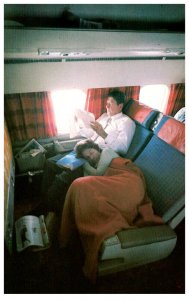 Nancy  Reagan sleeping on Ronalds lap on plane