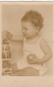 RP: Baby playing with blocks 1910-20s