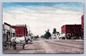 J90/ Rock Valley Iowa Postcard c1910 Main Street Stores Wagon 595