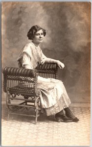 Young Lady Sitting On Chair Wearing Long Dress Real Photo RPPC Postcard