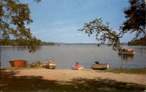 Lake Winnisquam New Hampshire Boats Docked on Sand Summer Fun Vintage Postcard