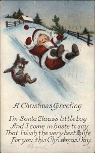 Christmas Little Boy in Santa Suit Sliding Down Hill c1910 Vintage Postcard