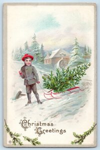 Christmas Postcard Greetings Little Boy Pulling Cart Pine Tree Winter Embossed
