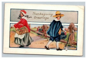 Vintage 1900's Thanksgiving Postcard Man Axe Turkey's Woman with Basket Apples