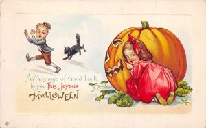 Halloween Greetings Children Girl Hiding behind Pumpkin Postcard AA69303