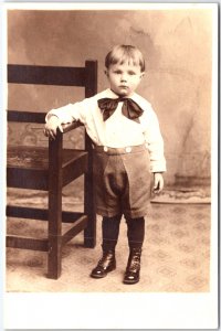 Young Boy in White Shirt, Shorts and Large Bow Tie Portrait - Vintage Postcard