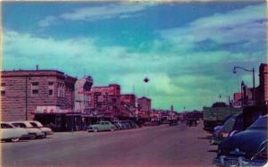 Cody Wyoming~Main Street~Coca Cola~NICE Classic Cars~1950s Postcard