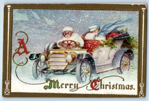 Christmas Girl Driving Car With Holly Berries Snow Winter Scene Antique Postcard