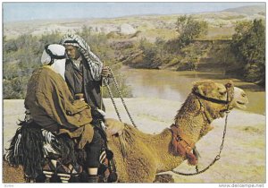 Two Men riding camels toward the Jordan River, Israel, 50-70s