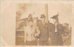 c1908 RPPC Real Photo Postcard Man With Two Fancy Women On Corner
