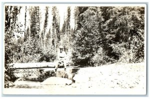 1911 Man Sat On Log River Scene Kalispell Montana MT RPPC Photo Antique Postcard