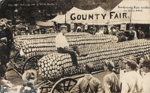 Exaggerated corn County Fair by W H Martin RPPC 1911
