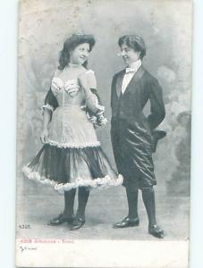 1905 Risque WOMAN WEARING HEART-SHAPED PATTERN ON CHEST AREA OF DRESS AB7301