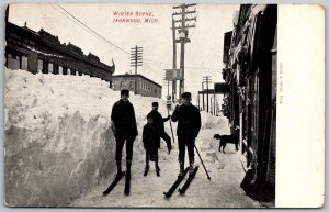 Ironwood Michigan 1910 Postcard Winter Scene Snow Skiers Downtown Stores Dog