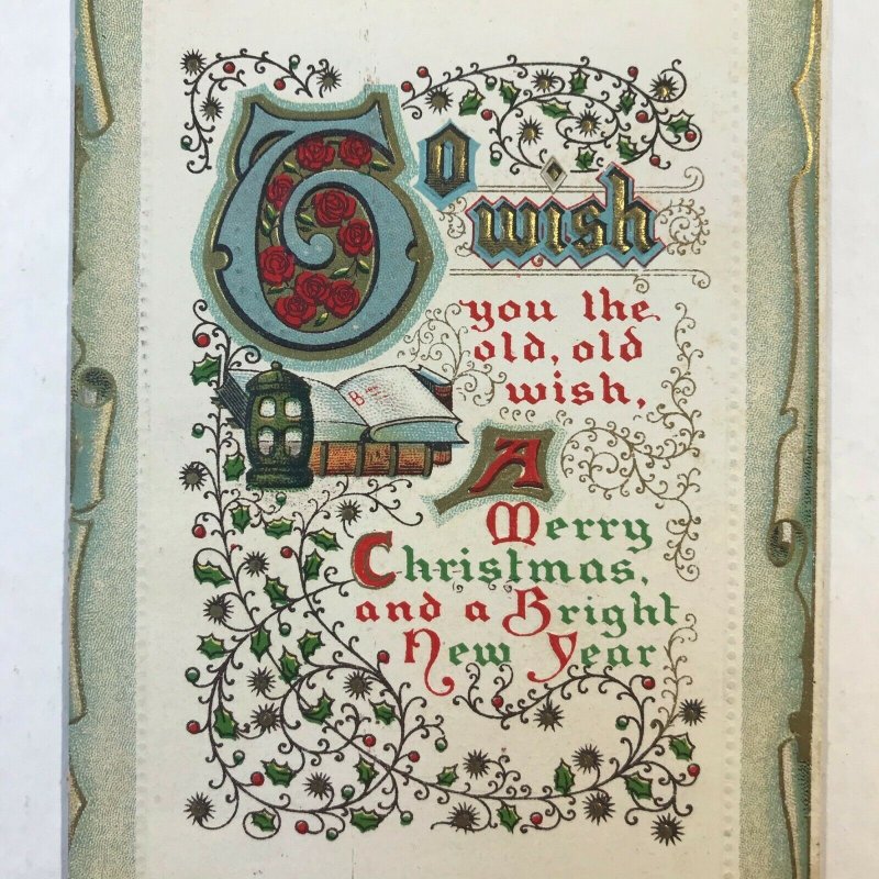 C.1911 Christmas Book Lantern Scroll Ivy Embossed Border Postcard McKinley