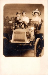 Real Photo Studio Postcard Two Women and Young Boy Sitting in Automobile