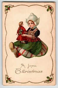 Christmas Postcard Dutch Girl Holds Doll John Winsch Back Germany Embossed 4391