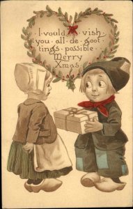 Christmas Dutch Children Boy Gives Gift to Girl c1910 Vintage Postcard