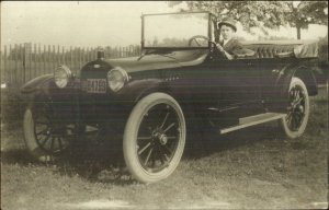 Boy Sitting in Early Car Auto Visible 1915 License Plate Real Photo Postcard