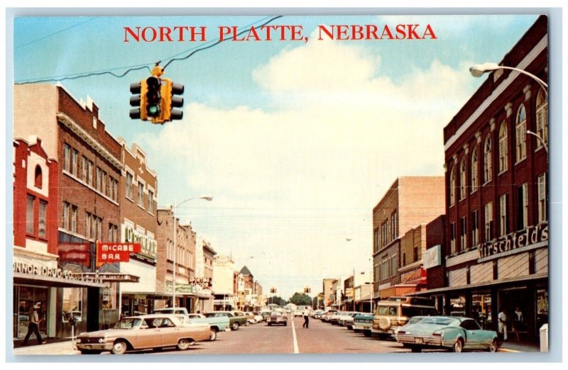 North Platte Nebraska NE Postcard Main Street McCabe Bar Cars Sporting Goods