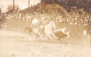 J45/ Miles City Montana RPPC Postcard c20s Rodeo Bulldogging Cowboy 85