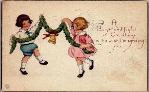 1922 CHRISTMAS DANCING MERRY CHILDREN GARLAND BELL POSTCARD 39-114