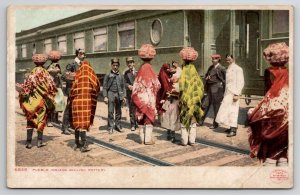 Pueblo Indians Selling Pottery At Train Car Postcard N23