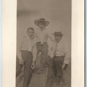 c1910s Group Cool Men Smoking RPPC Outdoors Friends Fun Guys Chillin Hat PC A212