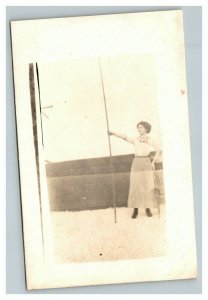 Vintage 1910's RPPC Postcard Portrait Woman in Backyard Holding Large Pole