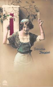 BG20411 1 january  woman with champagne mistletoe new year neujahr   germany