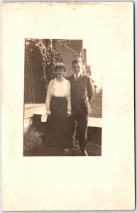 Man in Suit with Tie and Woman with Dark Dress Portrait - Vintage Postcard