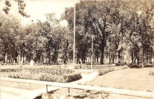 Sheldon Iowa~City Park~Hedges Along Paths~Little Kids @ Monument~Cannon~'43 RPPC