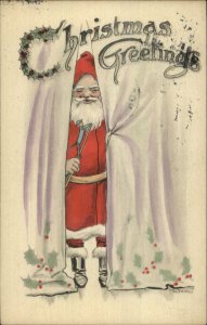 Christmas - Santa Claus w/ Toy Behind Curtains c1910 Postcard