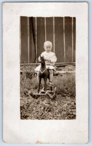 c1910's Little Girl Riding Rocking Horse Scene Field RPPC Photo Antique Postcard