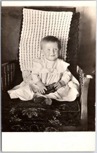 Baby Photograph Sitting on Couch White Dress Infant RPPC Real Photo Postcard