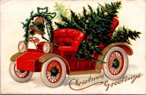 Christmas Postcard Red Open Air Automobile Filled with Pine Trees Gold Bell