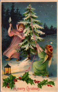 Christmas Postcard Two Angel Girls Chopping Down a Tree with an Axe in the Snow