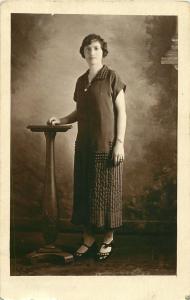 1925 REAL PHOTO POSTCARD RPPC WOMAN POSING WITH STYLISH DRESS & SHOES W/ BOWS