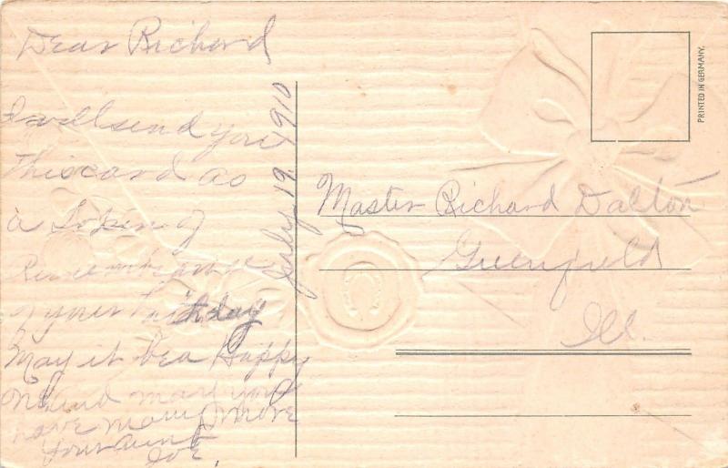 Birthday Greetings~Large Ribbon on Envelope~Seal~Clovers Stick Out~1909 Embossed