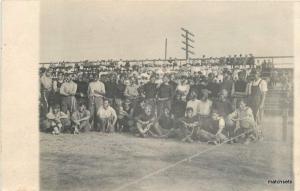 Circa 1910 Group of Men with face paint & String RPPC postcard 14262