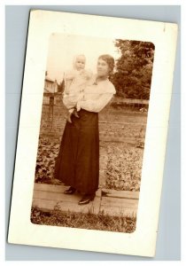 Vintage 1910's RPPC Postcard - Woman and Child Pose on Farm House in Distance