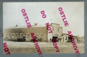 Oakes NORTH DAKOTA RPPC c1910 ADVERTISING Wagons Buggies LIVERY STABLE NE ND