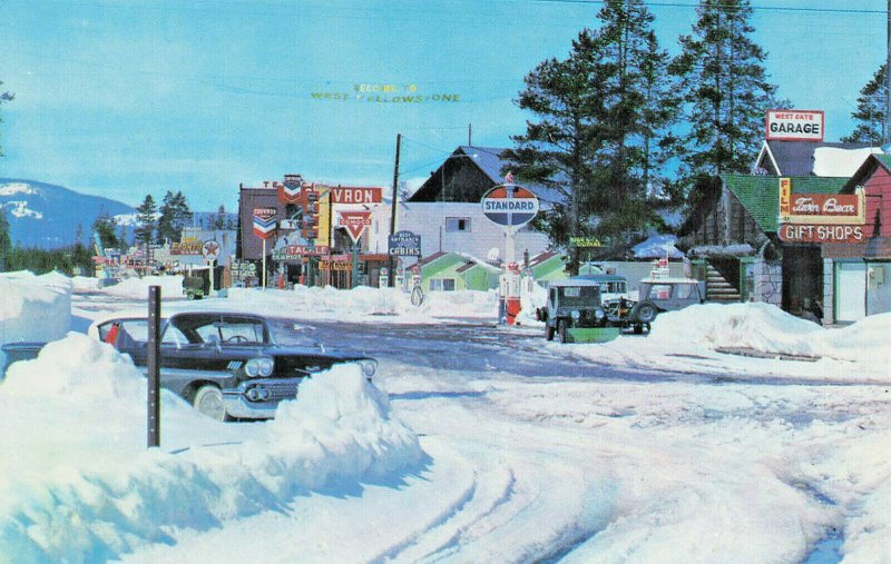 West Yellowstone MT Gas Stations Garage Snow Old Cars Postcard